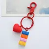Llavero de bloques de construcción de amor tridimensional personalidad creativa colgante para coche bolsa lindo colgante para bolsa de pareja femenina venta al por mayor