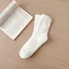 Calcetines de vellón de coral sin pelusa transfronterizos para hombre y mujer, calcetines de vellón de color liso, media caña, cálidos para dormir, calcetines de piso
