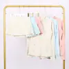 Traje de Chaqueta Lulu con Cuello Alto y Falda de Tres Pliegues Traje Deportivo de Fitness Falso de Dos Piezas Falda de Tenis Elástica Anti-Exposición Todas las Estaciones