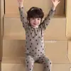 Nuevo conjunto de ropa de estar para niños de algodón puro, sin costuras y con Lycra, unisex, grado A, con diseños de dibujos animados, adecuado para usar en otoño como conjunto de camiseta de manga larga y pantalones o pijama