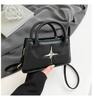 Bolso de mano personalizado de moda Primavera 2025 Nuevo bolso de hombro elegante y popular de este año Bolso de mano para ir al trabajo Bolso bandolera