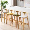 Silla de bar de madera maciza moderna y sencilla con respaldo para el hogar, taburete alto, silla de recepción nórdica para tienda de té con leche