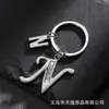 Llavero de estrella hueca con letra para comercio electrónico transfronterizo, llavero personalizado con letra nueva para hombre, accesorios