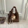 Bolsa Pequeña Retro Nueva Primavera 2026 Bolso de Hombro de Moda para Mujer Bolso Cruzado Informal para Ropa de Trabajo Bolso Cubo Tipo Canasta de Verduras