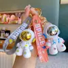 Llavero de muñeca astronauta de dibujos animados transfronterizo llavero de coche creativo llavero de bolsa de pareja lindo regalo pequeño venta al por mayor