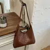 Bolsa de Ombro Retrô Transfronteiriça para Mulheres 2026 Nova Moda Trançada Grande Capacidade Simples Estilosa Bolsa de Mão Bolsa Tote