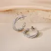 Pendientes de Otoño e Invierno 2024 Moda Elegantes Estéreo de Gama Alta Hebilla de Oreja Hilo Retorcido Anillo Liso Acero de Titanio Femenino con Estilo