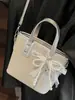 Bolso de Cubo Casual de Moda y Texturizado Nuevo Verano 2025 Elegante Simple de Nicho para Mujer Bolso de Hombro Cruzado