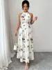 Vestido longo plissado com estampa floral, gola halter, amarração na cintura, barra larga, moda feminina transfronteiriça europeia e americana, verão 2026, elegante