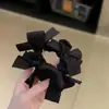 Diadema de lazo trenzado de diseño de nicho estilo coreano para moño que realza el volumen, Cuerda para coleta de alta gama para mujer