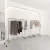 Colgadores de tienda de ropa acero inoxidable plata cepillada estantes de exhibición de tiendas de mujeres en el estante central escaparate piso