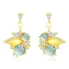 Estilo antiguo, sensación fresca y distante, nueva tendencia nacional china, mariposa dorada, material peligroso natural, aretes de jade en tono azul, aretes de botón estilo ins para mujer