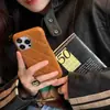 Funda de teléfono de cuero con patrón Maillard para Apple 15promax iPhone14 rombo 13 resistente a caídas 15pro femenina lujo
