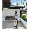 Camiseta de Manga Corta IA para Mujer Verano 2026 Nuevo Estilo Diseño de Estampado de Cachorro Sentido del Diseño Puro Deseo Hombro Descubierto Asimétrico Top