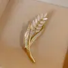 Corsage de trigo de alta gama, nuevo, de nicho, moda, broche transfronterizo, accesorios anti-luz para mujer de alta gama, venta al por mayor de fábrica