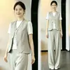 Conjunto de Quatro Peças Primavera/Outono 2026 Lenço de Seda Decorativo Colete de Gola V Calça Wide Leg Fluida de Cintura Alta Terno de Temperamento Capaz