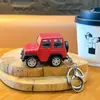 Llavero creativo de aleación de vehículo todoterreno de fricción, divertido juguete colgante de descompresión para estudiantes, regalo del festival 61, venta al por mayor