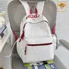 Nuevo modelo 2026 mochila casual estampada estilo ins para estudiantes de secundaria y primaria, mochila ligera de gran capacidad para ir a la escuela para niñas