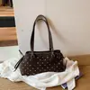 Bolso de mujer de diseño nicho 2026 nuevo bolso de hombro cruzado de verano versión coreana ins bolso de mano de lunares bolso tote