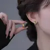 Aretes de hoja de plata 999 con aguja, cuidado de perforación de oreja, no es necesario quitárselos al dormir, nuevos aretes populares de nicho 2026 para mujer