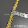 Vendas diretas da fábrica: Borda de renda com fio dourado de 2,5 cm, adequada para mercados domésticos e internacionais, usada como acessório de vestuário para vestidos, saias e outros itens de vestuário