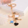 Estilo coreano criativo Lucky Clover casal chaveiro de metal pingente pequeno presente chaveiro saco pingente atacado