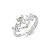 Anillo Cruzado Más Vendido Creativo de Ángel y Demonio con Piedra Lunar, Diseño de Nicho, Anillo de Pareja Ajustable para Hombres y Mujeres