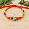 2026 Nuevo Modelo Festival del Bote del Dragón Pulsera de Cuerda Colorida Joyería Aleación Zongzi Bebé Tejido Pareja Pulsera de Hilo de Colores Venta al por Mayor