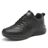 Tenis de mujer completamente negros para primavera y otoño, superficie de piel, impermeables, suela suave, ligeros, negro puro, cómodos para estar de pie mucho tiempo, zapatos de trabajo, talla grande