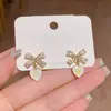 Pendientes de botón de lazo corazón con microincrustaciones de circonita, diseño de nicho, pendientes de moda de alta gama, al por mayor