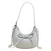 Este ano, a bolsa portátil estilo doce com laço simples e popular, nicho casual de alta qualidade, bolsa transversal feminina versátil