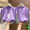 Camiseta de manga larga a rayas de algodón puro para niñas, colección primavera/otoño 2026, estilo nuevo, diseño de caricatura lindo, capa base versátil y a la moda