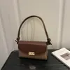 Outono de 2026 Novo Estilo Elegante Temperamento Fashionável Exquisito Nicho Versátil Simples Retrô Bolsa Quadrada Pequena de Ombro Cruzado de Mão