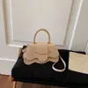 Bolso Pequeño Cuadrado Versátil de Diseño de Nicho de Moda para Mujer 2026 Elegante de Color Sólido Estilo Pequeño Chanel Alta Textura Bolso Cruzado de Mano