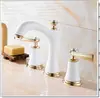 Grifo de latón estilo europeo, doble manija, giratorio 360 grados, tres agujeros, manija de cruz, juego de grifo para lavabo