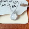 Venta al por mayor de fábrica calcedonia semilla de hielo colgante de huevo redondo de princesa grande cereza pequeña plata incrustada colgante de jade ágata blanco