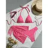 Marca independiente 2026 Nuevo conjunto sexy de bikini de tres piezas europeo y americano con falda de tul, traje de baño de cuello halter, bikini al por mayor
