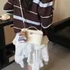 Bolso de Mano Moda Primavera Bolso Tote Pequeño para Mujer 2026 Modelo Nuevo Color Sólido Bolso Cuadrado Pequeño Simple con Patrón de Lichi Bolso de Hombro Cruzado Único