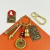 Llavero Guardián Divino del Zodiaco del Éxito con Bolígrafo y Diseño de Torre para Hombres y Mujeres, Accesorios Colgantes para Bolsas de Llaves de Coche Venta al por Mayor
