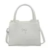 Bolso de mano con lazo estilo Ins para mujer, nuevo modelo 2026, simple y elegante, de nicho y exquisito, adecuado para ir al trabajo, se puede llevar como bolso de hombro o cruzado
