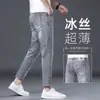 Jeans para hombre de moda europeos y americanos, etiqueta de cuero de alta gama a la moda, nuevos pantalones casuales ajustados Skinny elásticos