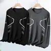 Temporada de primavera y otoño, camiseta lisa popular de manga larga, corte holgado, cuello redondo, unisex, top simple y versátil