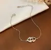 Pulsera de Plata de Ley S925 Chapada en Oro de 18K con Doble Anillo Entrelazado para Mujer, Diseño Personalizado de Nicho Versátil, Joyería de Mano Simple de Lujo Ligero