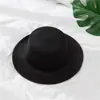 Outono e inverno Novo chapéu masculino britânico chapéu de lã de topo plano estilo europeu e americano chapéu de jazz com aba chapéu feminino atacado