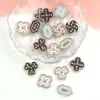 ABS estilo coreano blanco y negro trébol de cuatro hojas DIY pegamento de crema accesorios para joyería pequeños accesorios pendientes pasador de pelo agujero material para zapatos