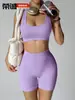 Nuevo conjunto de yoga transfronterizo: Shorts de fitness tipo durazno sin costuras que levantan los glúteos con almohadillas en el pecho, top deportivo y sujetador de yoga
