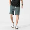 Pantalones cortos casuales de verano finos de algodón y lino para hombre, holgados, talla grande, color liso, shorts de playa, pantalones de longitud media modernos