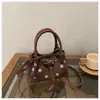 Bolso cubo de moda de lunares transfronterizo, diseño de nicho, bolso de hombro cruzado con hebilla de cinturón, bolso de mano vintage versátil para ir al trabajo