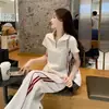 Conjunto de moda callejera para mujer, estilo coreano moderno, conjunto de dos piezas casual deportivo de alta gama con pantalones anchos de manga corta