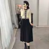 Suéter tejido con diseño de dos piezas falso, elegante vestido plisado estilo Chanel 2026 adelgazante, elegante y alargador vestido largo